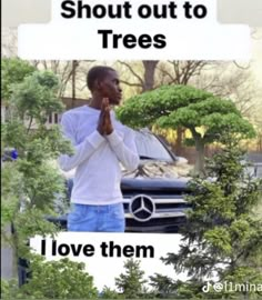 a man standing in front of a car holding his hands together with the words, i love them