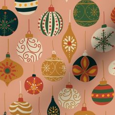 a pink background with christmas ornaments hanging from it's sides and on the side