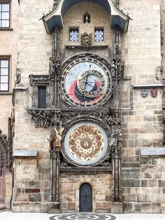 an ornate clock on the side of a building