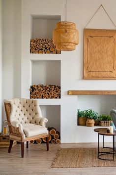 a living room filled with furniture and a fire place next to a painting on the wall