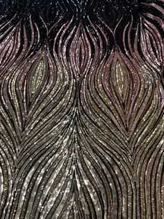 the back side of a black and gold sequinned dress with large, wavy lines