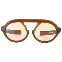 Hardly seen up for sale, " Jardin Dior " this robust frame is a true rarity since its not made from optyl, rather a sample. Lenses are spotless brown. Please notice this item its nearly 60 years old and may show minor sign of wear due to storage. This pair is a must have for a collector! a great opportunity to achieve a unique and yet timeless look Mesurements: Front : 16 cms Lens height : 4.6 cms Lens width : 5.6 cms Unique Eyewear, Dior Sunglasses, Vintage Glasses, Eyewear Design, Eyewear Accessories, Designer Sunglasses