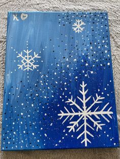 a blue and white painting with snowflakes on it