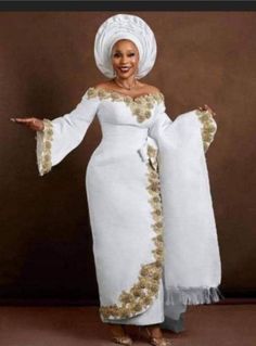 This dress is made of a metallic woven material, Nigerian Wedding Dress, African Bridal Dress, African Wedding Attire, Traditional Wedding Attire, Special Event Dresses, African Wedding Dress, African Lace Dresses, Aso Oke, Traditional Wedding Dresses