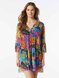 Add feminine charm to your warm-weather style in the Coco Reef Enchant Cover Up Dress. This tiered babydoll dress is made from lightweight fabric that gives you a cool and comfortable overswim option. Featuring a vibrant and colorful jungle inspired print, this swimsuit cover up is as fashionable as it is functional.   Swimsuit Cover Up Dress V-Neckline Bell Sleeves Fabric Content: Signature Mesh - 94% Nylon / 6% Spandex Hand Wash Cold, Line Dry   Model Dimensions Vlada - Height: 5'10", Waist: 2 Casual V-neck Tiered Dress For Beach, Green Tiered Ruffle Dress For Beach, Summer V-neck Tiered Dress For Vacation, Green Summer Tiered Dress, Casual Tiered Ruffle Dress For Beach, Tiered Beachwear Dress For Beach Season, Tiered Beach Dress For Beach Season, Casual V-neck Tiered Dress For Vacation, Multicolor Tiered Dress For Summer