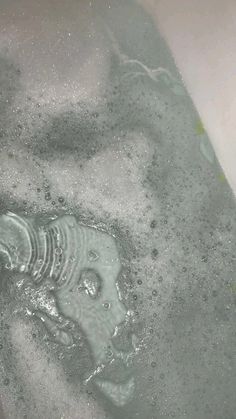 the water is running down the drain in the sink and it appears to be very dirty