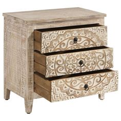 two drawers with carved designs on them and one drawer open to show the bottom section