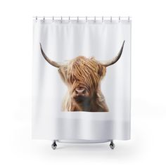 a shower curtain with an image of a cow's head