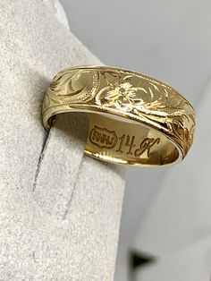 14k Yellow Gold Hand Engraved Hawaiian Ring Plumeria & Scrolling Size 13.25. This ring is very beautifully engraved with scrolling and plumeria design. Size is 13.25 roughly. The ring is about 8mm. The ring is barrel outside. Condition is Pre-owned. Shipped with USPS Priority Mail Padded Flat Rate Envelope. Sold as is no returns Engraved Band Engagement Ring, Hawaiian Ring, Plumeria Design, Hand Engraved Wedding Band, Belt Ring, Carved Ring, Engraved Wedding, Gold Hand, Band Engagement Ring