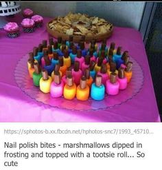 a table topped with lots of different colored bottles next to a plate filled with food