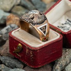 This great vintage mens 32° Masons ring features a diamond at the center of a white gold double eagle. The shoulders and shank of the ring are decorated with enameled masonic symbols. It is crafted in a patinated 10k yellow gold and is a size 8.5. We are not offering resizing due to the enameling. A small amount of enamel shows wear. Vintage Diamond Enamel Ring, Antique Engraved Diamond Ring Collectible, Art Deco Enamel Rings For Formal Occasions, Antique Engraved Enamel Ring For Formal Occasions, Antique Enamel Rings For Formal Occasions, Antique Enamel Rings For Collectors, Antique Enamel Rings As Collectibles, Vintage Enamel Anniversary Ring, Vintage Enamel Jewelry With Polished Finish