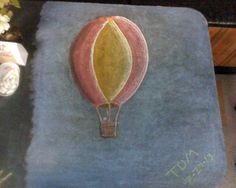 a painting of a hot air balloon on a rug