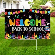 a welcome back to school sign in the grass