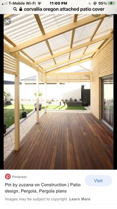 an outdoor covered patio area with wooden flooring