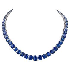 Presenting a sophisticated statement piece: the Ceylon Sapphire Diamond Tennis Necklace crafted from exquisite natural sapphires and diamonds, set in lustrous 18k white gold. Featuring 58 cushion sapphires totaling an impressive 130.26 carats, each stone certified by the esteemed GCI Laboratory for their Ceylon origin and thermal treatment indication. Accentuating the sapphire elegance are 489 dazzling diamonds, collectively weighing 1.49 carats, boasting a pristine F-G color and VS clarity. The necklace is fashioned from 18k white gold, with a substantial gross weight of 81.33 grams. With a total length of 17.5 inches (44.45 cm), the necklace offers versatility with a removable extension, allowing for a shorter length option of 16 inches (40.64 cm). Made by Spectra Fine Jewelry in 2022. 1stdibs Jewelry, Antique Diamond Necklace, Blue Diamond Necklace, Jewelry Sapphire, Blue Sapphire Jewelry, Diamond Pendants Designs, Sapphire Necklace Pendants, Diamond Tennis Necklace, Ceylon Sapphire