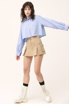 Micro-mini skirt look with lining shorts underneath Faux pocket on the sides Product Specification 97% Cotton 3% Spandex Flat measurement (XS/S) Waist 34cm / hip 43cm / length 35cm (S/M) waist 35.5cm / hip 41cm / length 33cm Professional Clean Only / Do Not Tumble Dry Model's height is 6' 8" (175cm) Bust 31in Waist 23in Hip 34in and wearing XS/S Made in Korea Chic Mini Length Shorts With Side Pockets, Spring Stretch Mini Skirt With Pockets, Casual Mini Skirt With Pockets, Short Denim Skirt With Pockets, Summer Mini Skirt With Pockets, Fitted Mini Skirt With Pockets, Summer Skirt With Pockets And Short Inseam, Stretch Short Skirt With Pockets, Chic Mini Skirt With Pockets And Short Inseam