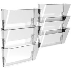 three clear glass shelves are stacked on top of each other