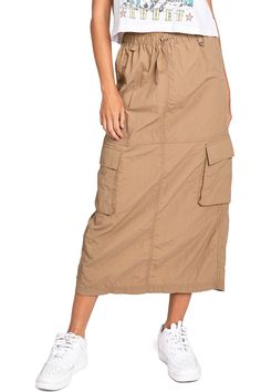 Chic, parachute skirt with an elastic waistband, a drawstring cinch tie and cargo pockets down the sides. Pair it with a graphic tee and sneakers for an effortless streetwear look. CARE | Machine Wash Cold CONTENTS | 100% Nylon MEASUREMENTS | 33"/85 cm Top to Bottom (Size Small) MODEL | 5'8 - wearing a size Small IMPORTED Parachute Skirt, Short Denim Skirt, Love Tree, Cargo Skirt, Short Mini Dress, Knit Sweatshirt, Midi Maxi Dress, Skirt Leggings, Basic Tops