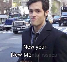 a man in a suit and tie standing on the street