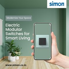 a person holding up a smart phone with the text moderne your space electric modular switches for smart living