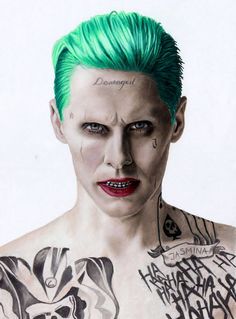 an image of a man with green hair and tattoos on his chest, looking at the camera