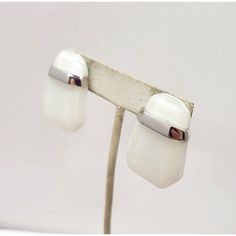 1980s Modernist geometric rhodium plated white Lucite pierced push back earrings. Marked "TRIFARI©" and "Kunio Matsumoto" both in script. Measure: 1 3/8 inches long by 1 inch wide.   Excellent condition. Identical earrings were featured in an advertisement, year unknown. Modern White Earrings For Anniversary, Modern White Clip-on Earrings, Modern White Earrings For Formal Occasions, Modern White Clip-on Earrings For Gift, Modern White Rectangular Earrings, Formal White Sterling Silver Clip-on Earrings, Modern Metal Clip-on Earrings For Anniversary, White Metal Clip-on Earrings For Anniversary, Anniversary White Metal Clip-on Earrings