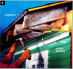 a man is working on the roof of a house that has been painted green and yellow