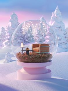 a snow globe with a couch and table inside in the middle of it, surrounded by snowy trees