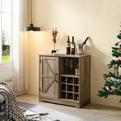 a living room with a christmas tree in the corner and wine bottles on the shelf