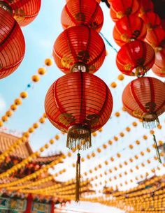 many red lanterns hanging from the ceiling