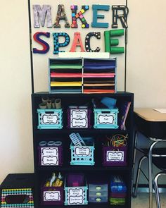 a shelf filled with lots of craft supplies next to a sign that says maker space