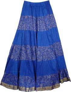 Blue Cotton Crisp Tall Skirt with Wide Hem with Golden Print and Brocade - A beauty in real blue - a beautiful true blue skirt with crinkle effect that is in a bohemian royal style with alternative plain and gold printed fabric. Skirt is stylish, easy to wear, and is one of this season`s hottest looks! This is a quality cotton Crinkle Long Skirt with Golden Brocade-lace Work and golden floral rendition in hand block print. The Tall Cotton Skirt has an elastic and drawstring waist, with cotton ha Blue Flowy Maxi Skirt For Festivals, Festival Blue Lined Maxi Skirt, Festive Long Blue Skirt, Traditional Blue Maxi Skirt, Traditional Blue Flowy Maxi Skirt, Traditional Blue Lined Skirt, Blue Summer Festive Bottoms, Blue Summer Bottoms For Festive Occasions, Blue Festive Summer Bottoms