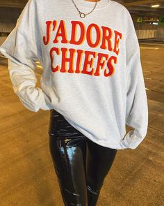 J'ADORE CHIEFS. The softest, comfiest, sweatshirt that is also stylish? Say less.  Seriously, you will live in this sweatshirt. UNISEX Sizing- available in S, M, L, AND XL. Models wears XL! CARE INSTRUCTIONS: Wash inside out in cold water. Air or tumble dry! Fall Fan Merchandise Sweatshirt With Text Print, Game Day Fan Apparel Sweatshirt In Athletic Heather, Athletic Heather Sweatshirt For Game Day, Football Season Fan Merchandise Sweatshirt With Letter Print, Athletic Heather Fan Apparel Sweatshirt For Fall, Athletic Heather Sweatshirt With Letter Print For Game Day, Athletic Heather Letter Print Sweatshirt For Game Day, Crew Neck Sweatshirt With Text Print For Fans, Fan Gear Text Print Crew Neck Sweatshirt