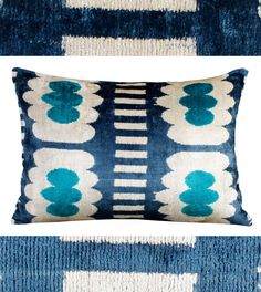 two blue and white pillows sitting on top of each other