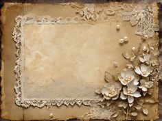 an old paper with lace, flowers and pearls on the edges is displayed in this image