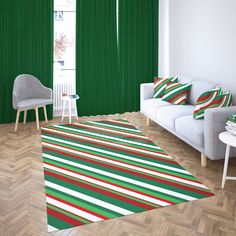 a living room with green curtains and red, white, and green striped rugs