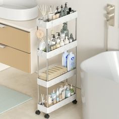 a bath room with a tub and a shelf filled with bathroom items next to a sink