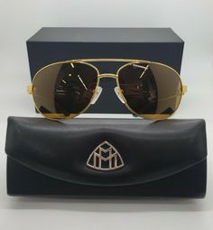 MAYBACH EYEWEAR THE MONARCH IV G-WAK-Z03 POLARIZED MENS SUNGLASSES FRAMES 64-16-140!!! Measurements Eye size: 64 Bridge: 16 Temple Length: 140 SELLING BRAND NEW LIMITED EDITION MAYBACH SUNGLASSES!! MADE WITH BUFFALO HORN, LEATHER AND GOLD-PLATED TITANIUM! WITH ZEISS POLARIZED LENSES! 100% AUTHENTIC!! COMES WITH GENUINE MAYBACH BOX, CASE AND CLOTH! STYLE: THE MONARCH IV LENSES: Brown Polarized (100% UVA&UVB) ACTUAL SUNGLASSES ARE PHOTOGRAPHED! MADE IN GERMANY! Thank you! Luxury Brown Shield Sunglasses With Polarized Lenses, Luxury Polarized Aviator Sunglasses For Summer, Luxury Brown Sunglasses With Anti-reflective Coating, Designer Tinted Sunglasses For Outdoor, Luxury Aviator Sunglasses With Gradient Lenses For Outdoor, Gold Polarized Sunglasses For Travel, Luxury Sunglasses With Uv Protection For Travel, Modern Polarized Aviator Sunglasses For Formal Occasions, Designer Polarized Sunglasses For Outdoors