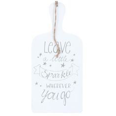 a white ceramic sign with the words leave a little sparkle wherever you go on it