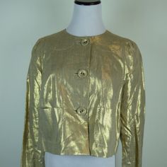 Whistles London Gold Metallic Linen Jacket / Top Size 8..Uk12..Fully Lined.. Covered Button Front.. Small Pockets Front..Fine Stitch Detail! Extra Button ...So Pretty And Versatile..Wear It Dress Up Or Down.. Made In Romania... Pleat In Back Gives You Some Extra Room .. Condition: New Without Tags Measures Sleeve 30 Bust 39 Hem Laying Flat Across 24 Includes Pleat Open Length 18 Classic Cropped Jacket For Spring Evenings, Designer Gold Single-breasted Outerwear, Designer Gold Single Breasted Outerwear, Designer Spring Blazer With Button Closure, Tailored Gold Blazer For Spring, Gold Long Sleeve Outerwear For Spring, Designer Gold Blazer With Button Closure, Gold Chic Single Breasted Outerwear, Designer Long Sleeve Outerwear With Gold Buttons