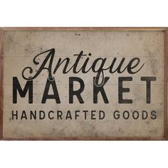 antique market handcrafted goods sign hanging on a wall in front of a white background