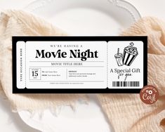 a movie ticket sitting on top of a white plate