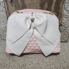 Brand New Betsy Johnson Purse. Lost Price Tag But Ring That Connects Tag Is Still Attached. Pink, White And Gold. Perfect Condition. Smoke Free Home. Cute White Shoulder Bag For Party, White Everyday Bags With Bow Detail, Cute White Bag With Bow, Trendy White Bag With Bow, Trendy White Shoulder Bag With Bow, Feminine White Bag For Party, Feminine White Party Bag, Feminine White Bag With Detachable Strap, Feminine White Shoulder Bag With Detachable Strap