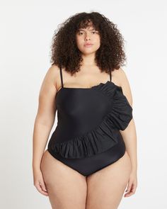 This swimwear collection is amazing! The Sarita one-piece is perfect, with a unique draped ruffle overlay and versatile removable straps. Plus, it's made from recycled polyamide in an eco-friendly way - making this piece both stylish and sustainable! Make a splash in this plus-size one-piece from our size-inclusive swimwear collection. Tanya Taylor Sarita One-Piece | BLACK | Swimsuits | Materials & Care Instructions: ['78% Nylon, 22% Elastane', 'Hand wash', 'Made in USA'] Ruffled Nylon Beachwear Swimwear, Ruffled Nylon Swimwear For Pool, Ruffled Nylon Swimwear, Curvy Hips, Swimsuit Material, Plus Size One Piece, Tanya Taylor, Seductive Clothes, Black Swimsuit