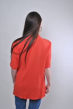 "Vintage minimalist short sleeve orange blouse, Size L Welcome to TARASCOMMON.ETSY.COM Unique clothing from the 20th century. Model tall - 170cm L. Sleeve - 9cm / 3.54inch; ( armpit to end of sleeve); Width - 50cm / 19.68inch; Length - 75cm / 29.52inch. All measurements are taken seam to seam while lying flat. Polyester/viscose. This item is vintage, so it can have some defects. Additional photos can be send We are glad that you are interested in lots that we sell. Wish you a good shopping! FOLL Orange V-neck Shirt For Summer, Orange V-neck Summer Shirt, Orange Short Sleeve Shirt For Spring, Summer Orange V-neck Shirt, Orange Collared Summer Blouse, Orange Short Sleeve Blouse For Spring, Orange Short Sleeve Casual Blouse, Casual Short Sleeve Orange Blouse, Orange Casual Short Sleeve Blouse