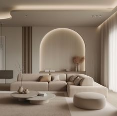 a modern living room with white furniture and beige walls, along with a large arched window