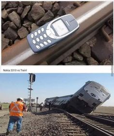 there is a cell phone laying on top of the train tracks next to a man in an orange shirt