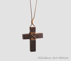 Wooden cross necklace, Man Cross. Fine wood cross necklace  made of walnut wood and waxed cord.  cross height - 1 7/8 inches (48 mm) The length of the cord is about 30 inches (77 cm), but it can be regulated by the movable knot Materials utilised: pear wood,  cord Production method  100% hand made by natural materials. ABOUT ME My name is Nikolin Georgiev and I live in Sofia, Bulgaria. I love creating beauty therefore I make jewelry. I love colours and stones' emanation. I also love the soft war Pear Wood, Wooden Cross, Wood Crosses, Cross Jewelry, Buy Handmade, Walnut Wood, Natural Materials, Custom Items, Mother Nature