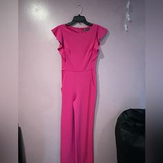 Brand New Pink Jumpsuit From Dillards, Perfect To Dress Up Or Down. Great For Pageant Interview, Deca, Fbla,Ect. Wide Leg, And Has 2 Pockets In The The Front. Cute Sleeve Detail. Pink Fitted Jumpsuit For Formal Occasions, Pink Fitted Pantsuit For Night Out, Pink Fitted Formal Jumpsuit, Fitted Pink Jumpsuits And Rompers For Work, Pink Fitted Jumpsuit For Work, Fitted Pink Jumpsuits For Work, Elegant Pink Short Sleeve Jumpsuits And Rompers, Elegant Pink Short Sleeve Jumpsuit, Pink Fitted Short Sleeve Jumpsuit