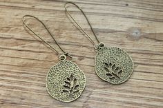 "Brass Earrings Dangle Earrings Drop Earrings Tree Earrings Leaf Earrings Christmas Gift For Her Gift For women Finish : Antiqued Brass Tree round Size : 2\"3/4 inches including the antiqued Brass kidney ear wire Ear wires : Antiqued Brass kidney ear wire Brass earrings section : https://www.etsy.com/shop/NtikArtJewelry?ref=seller-platform-mcnav&section_id=16059931 Thanks for looking" Nature-inspired Drop Earrings With Lever Back Ear Wires, Bohemian Leaf-shaped Metal Earrings, Bohemian Leaf-shaped Pierced Earrings, Bohemian Metal Earrings With Lever Back Ear Wires, Bohemian Metal Earrings With Lever Back, Bohemian Earrings With Lever Back Ear Wires, Nature-inspired Metal Drop Earrings, Lover Earrings, Rustic Earrings